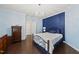 Stylish bedroom showcasing two-tone wall design, chandelier, and wood flooring at 123 Turnstone Dr, Durham, NC 27703