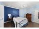 Comfortable bedroom features stylish decor, unique chandelier, and a mix of blue wall tones at 123 Turnstone Dr, Durham, NC 27703