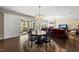 Inviting dining space open to the living area and screened porch with view of outdoor seating at 123 Turnstone Dr, Durham, NC 27703