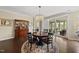 Elegant dining area featuring a round table, chandelier, and access to the outdoor living space at 123 Turnstone Dr, Durham, NC 27703