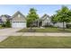 Charming home with a well-manicured lawn, two-car garage, and lovely landscaping at 123 Turnstone Dr, Durham, NC 27703