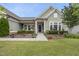 Charming front porch with lovely landscaping and an inviting entryway at 123 Turnstone Dr, Durham, NC 27703