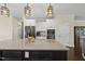 Bright kitchen with stainless steel appliances, a large island, and stylish pendant lighting at 123 Turnstone Dr, Durham, NC 27703