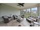 Inviting sunroom with comfortable seating and large windows overlooking the backyard at 123 Turnstone Dr, Durham, NC 27703