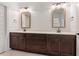 Bathroom showcasing a double vanity sink and elegant mirrors at 124 Lord Ashley Rd, Raleigh, NC 27610