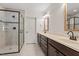 Bathroom featuring a glass shower and double sink vanity at 124 Lord Ashley Rd, Raleigh, NC 27610