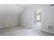 Bedroom with neutral carpet and paint leading to an adjacent room at 124 Lord Ashley Rd, Raleigh, NC 27610