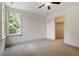 Bedroom featuring natural light, neutral carpet and paint, and large closet at 124 Lord Ashley Rd, Raleigh, NC 27610