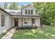 Inviting entrance featuring wood pillars and a beautifully stained wooden front door at 124 Lord Ashley Rd, Raleigh, NC 27610