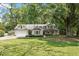 Charming single-story home featuring a manicured front lawn and attached two-car garage at 124 Lord Ashley Rd, Raleigh, NC 27610
