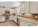 Updated kitchen with granite counters, stainless appliances, tile backsplash, and hardwood floors at 124 Lord Ashley Rd, Raleigh, NC 27610