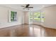 Spacious living room featuring hardwood floors and large bay windows at 124 Lord Ashley Rd, Raleigh, NC 27610