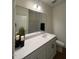 Bathroom vanity with double sinks, modern lighting, and neutral decor at 125 Fraiser Fir Way, Lillington, NC 27546