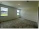 Inviting bedroom featuring neutral carpeting and natural light from dual windows at 125 Fraiser Fir Way, Lillington, NC 27546