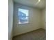Bedroom featuring a window with blinds and neutral paint at 125 Fraiser Fir Way, Lillington, NC 27546