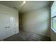 Comfortable bedroom with carpet flooring and double door closet at 125 Fraiser Fir Way, Lillington, NC 27546