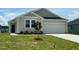 Charming one-story home featuring a two-car garage, complemented by a well-manicured lawn and inviting curb appeal at 125 Fraiser Fir Way, Lillington, NC 27546