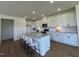 Bright kitchen featuring a large island, granite countertops and modern white cabinets at 125 Fraiser Fir Way, Lillington, NC 27546