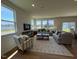 Open-concept living room with lots of light and neutral decor at 125 Fraiser Fir Way, Lillington, NC 27546