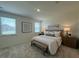Bright bedroom featuring neutral color palette, large windows, and bench seat at 125 Fraiser Fir Way, Lillington, NC 27546