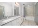 Spacious bathroom with double sink vanity and tiled shower at 1300 St Marys St # 408, Raleigh, NC 27605