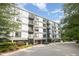 Modern condo building featuring balconies, large windows, well-maintained landscaping, and convenient access at 1300 St Marys St # 408, Raleigh, NC 27605