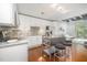 Open concept kitchen with stainless steel appliances and a view into the living area at 1300 St Marys St # 408, Raleigh, NC 27605
