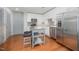 Modern kitchen with white cabinets, stainless steel appliances, and a central island at 1300 St Marys St # 408, Raleigh, NC 27605