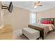 Calm bedroom featuring neutral tones, a ceiling fan, and comfortable furnishings at 131 Botanical Ct, Bunnlevel, NC 28323
