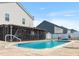 Backyard pool with screened in porch attached to home offering an outdoor retreat at 131 Botanical Ct, Bunnlevel, NC 28323