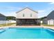 Backyard pool with screened in porch attached to home offering an outdoor retreat at 131 Botanical Ct, Bunnlevel, NC 28323