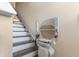 Stair lift on wooden staircase providing accessibility and convenience for residents at 131 Botanical Ct, Bunnlevel, NC 28323