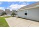 Concrete patio and yard space, perfect for outdoor activities and gatherings at 141 Beldenshire Way, Holly Springs, NC 27540