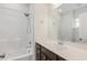 Bathroom featuring a shower/tub combo, a large mirror, and a single sink at 141 Beldenshire Way, Holly Springs, NC 27540