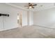 Carpeted bedroom with ceiling fan, recessed ceiling, and a mounted tv at 141 Beldenshire Way, Holly Springs, NC 27540
