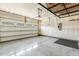 Spacious garage with ample room for parking and storage, featuring a clean and organized interior at 141 Beldenshire Way, Holly Springs, NC 27540