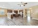 Open kitchen features stainless steel appliances, granite countertops, and dark wood cabinets at 141 Beldenshire Way, Holly Springs, NC 27540