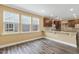 This is a kitchen with granite countertops, wood cabinets, recessed lighting, and wood floors at 141 Beldenshire Way, Holly Springs, NC 27540