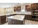 Modern kitchen features granite countertops, stainless steel appliances, and ample cabinet space at 141 Beldenshire Way, Holly Springs, NC 27540