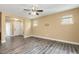 Spacious living room offers ample natural light and open layout to the foyer at 141 Beldenshire Way, Holly Springs, NC 27540