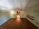 Attic space with wooden ceiling and floors and exposed lightbulbs at 141 S Broad E St, Angier, NC 27501