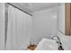 Modern bathroom with a shower, white sink, and stylish fixtures at 141 S Broad E St, Angier, NC 27501