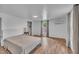 Bedroom with laminate flooring, neutral paint and window at 141 S Broad E St, Angier, NC 27501