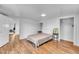 Bedroom with laminate flooring and neutral paint at 141 S Broad E St, Angier, NC 27501
