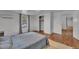 Bedroom with wood floors featuring a closet, blue comforter, and neutral walls at 141 S Broad E St, Angier, NC 27501