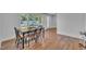 Charming dining area features hardwood floors and abundant natural light through large window at 141 S Broad E St, Angier, NC 27501