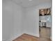 Versatile flex space with hardwood floors, leading to a modern white kitchen at 141 S Broad E St, Angier, NC 27501