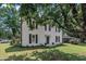 Well-maintained two-story residence with a green lawn and ample shade trees at 141 S Broad E St, Angier, NC 27501