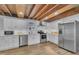 Updated kitchen features stainless steel appliances, white cabinets, and a wood ceiling at 141 S Broad E St, Angier, NC 27501