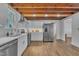 Updated kitchen features stainless steel appliances and wood flooring at 141 S Broad E St, Angier, NC 27501